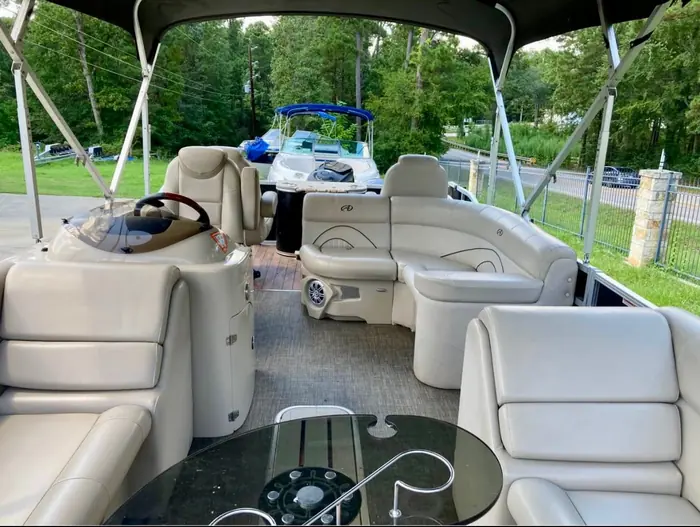 Pontoon deck with lounge seating and Bimini shade