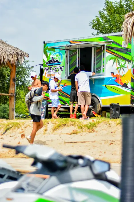Riders and the booth on the beach