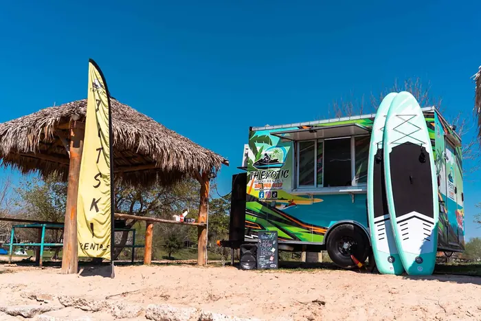 TH Exotic jet ski flag and rental booth at the park