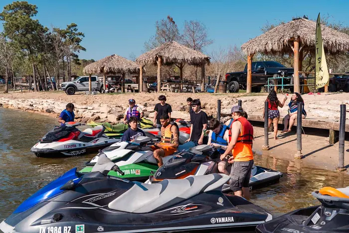 Jet skis pulled up on the beach