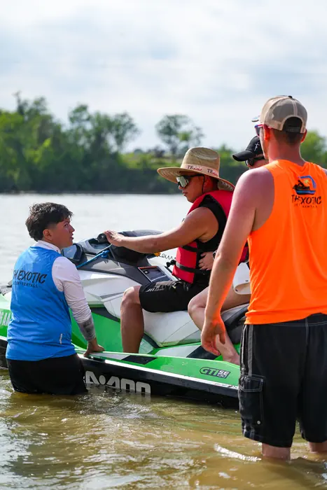 Staff launching a jet ski from the ramp