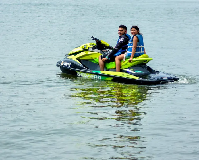 Two riders cruising on a jet ski